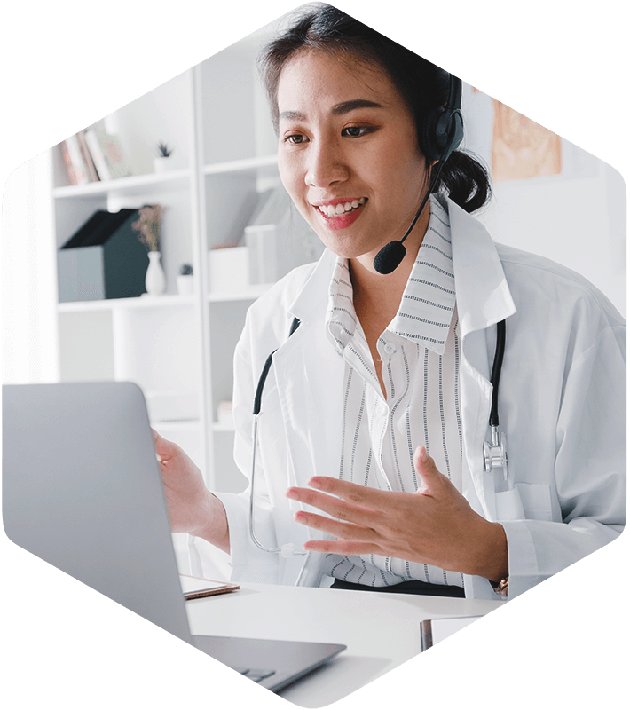 A healthcare professional in a modern office, seamlessly conducting a virtual consultation using Simulations Plus' advanced ADMET, PBPK, QSP, and Clin Pharm modeling and simulation software on your laptop. With their cutting-edge tools, you can confidently analyze complex data to enhance patient outcomes.